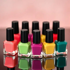 A close-up of a perfectly painted hand with different glossy colors from the peel-off nail polish set.
