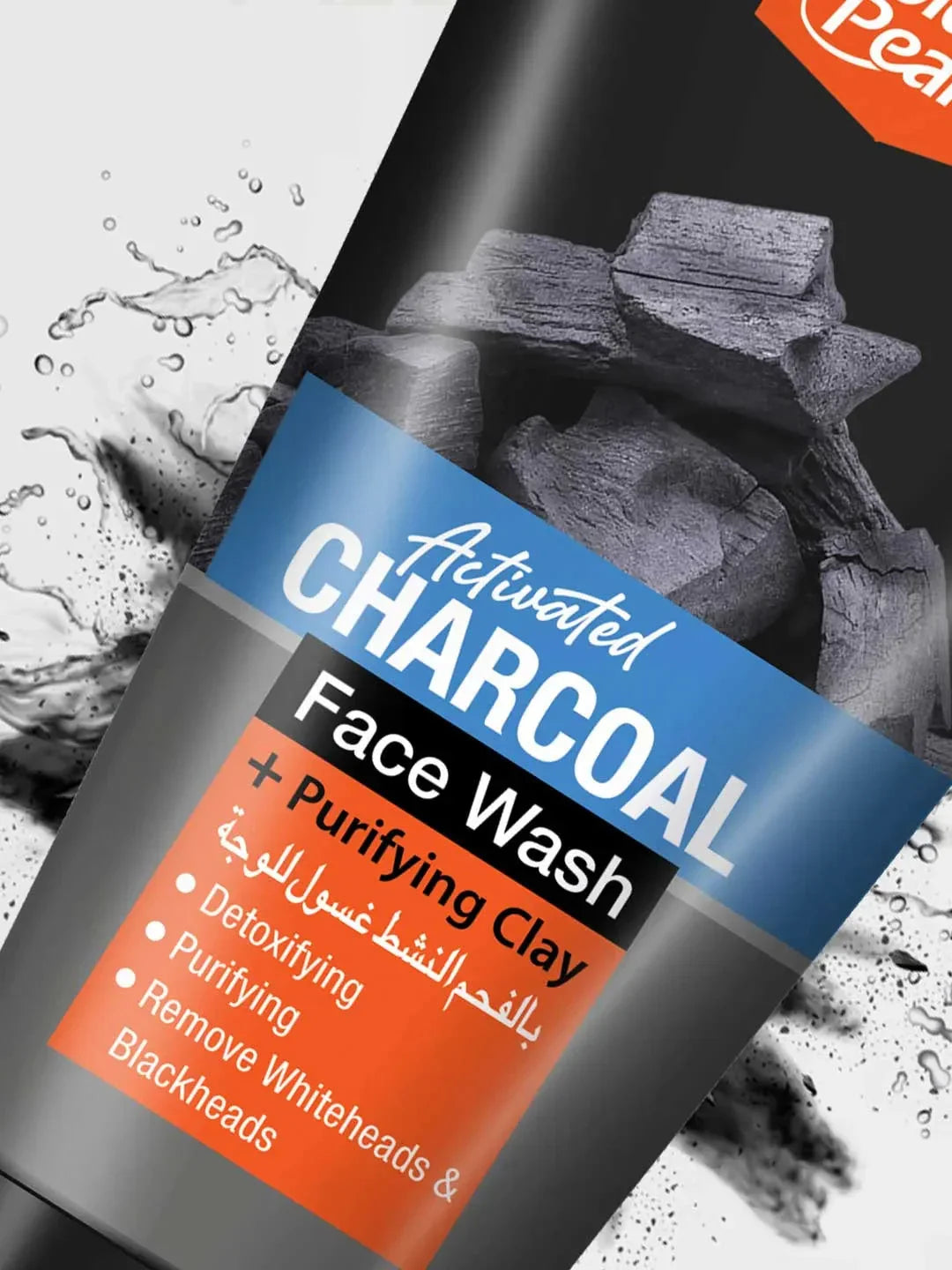 Activated charcoal face wash bottle with label on a textured background