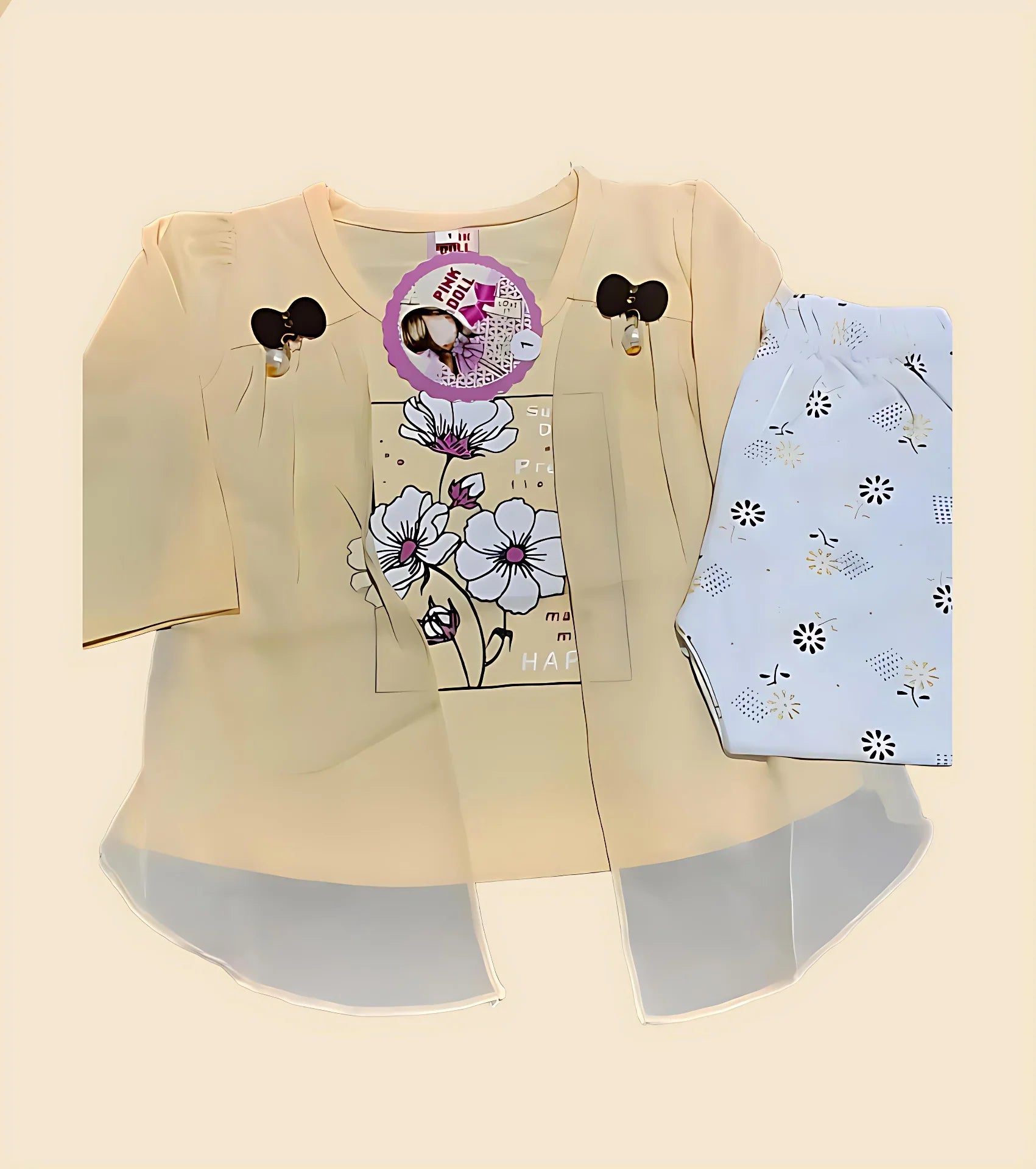 Beige cardigan with floral design and baby outfit on a beige background