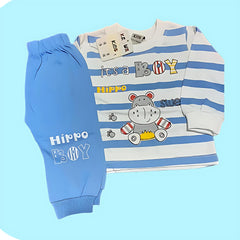 Children's outfit with striped shirt and blue pants on a light blue background