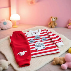 Children's red and white striped shirt with cartoon designs on a pink carpet with toys around