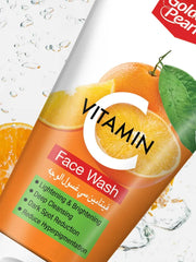 Vitamin C face wash bottle with oranges and water droplets on a white background