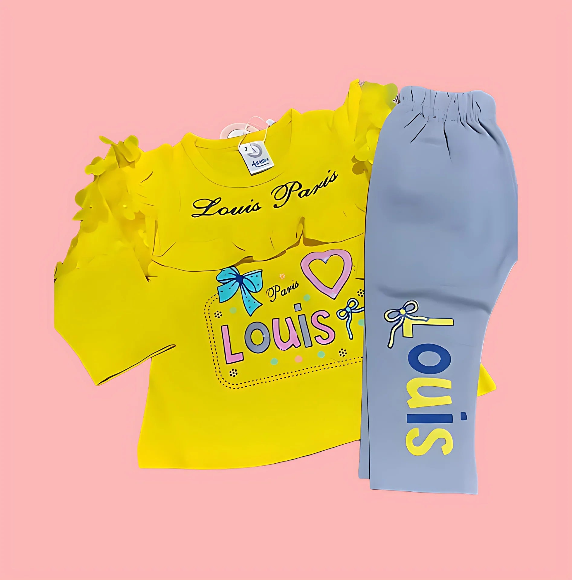 Yellow shirt with ruffles and blue pants with 'Louis' print on a pink background